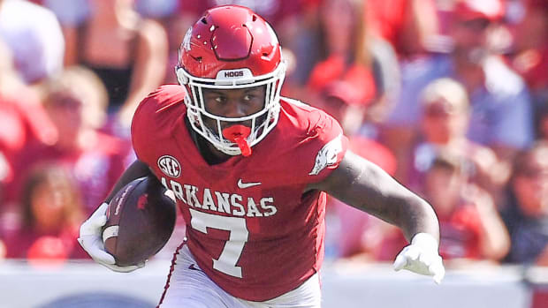 Razorbacks' Antonio Grier returns an interception for a score